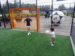 Max playing with a football at the Johan Cruijff Court at the Madurodam miniature park