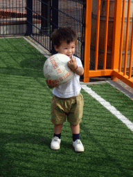 Max playing with a football at the Johan Cruijff Court at the Madurodam miniature park