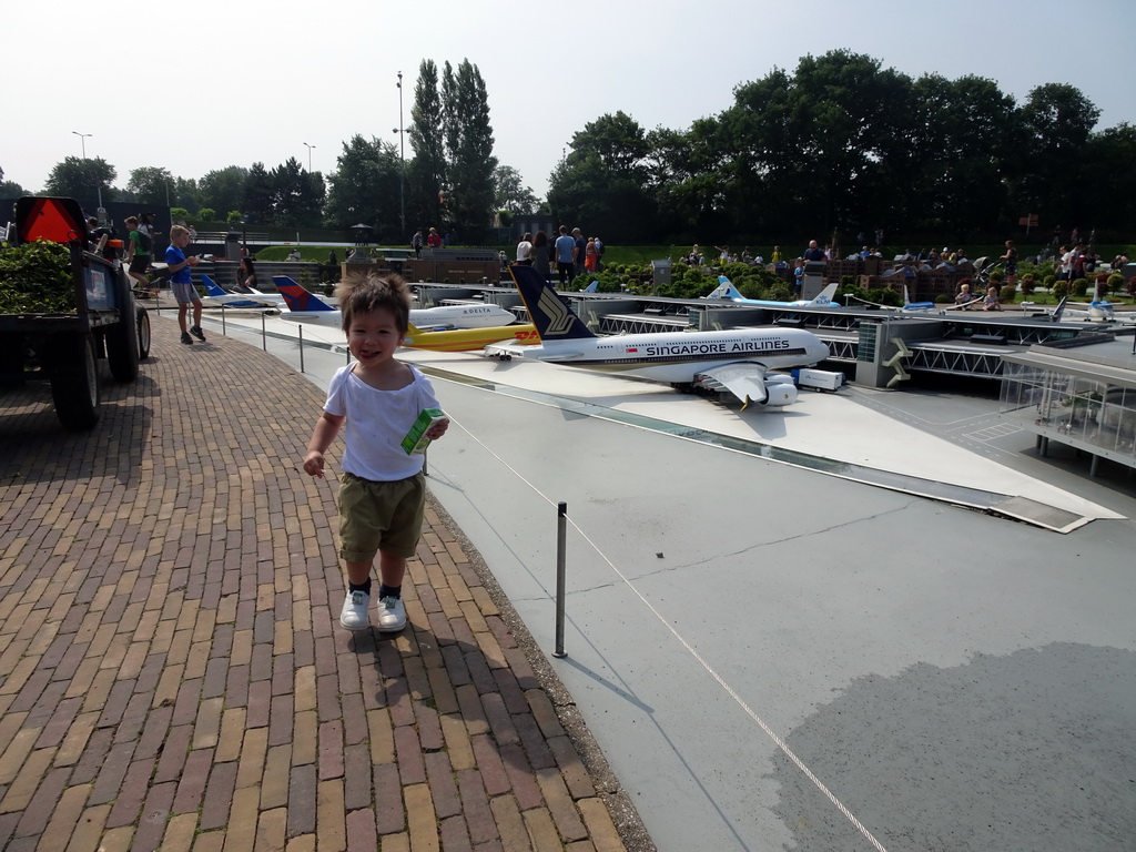 Max in front of the scale model of Schiphol Airport at the Madurodam miniature park