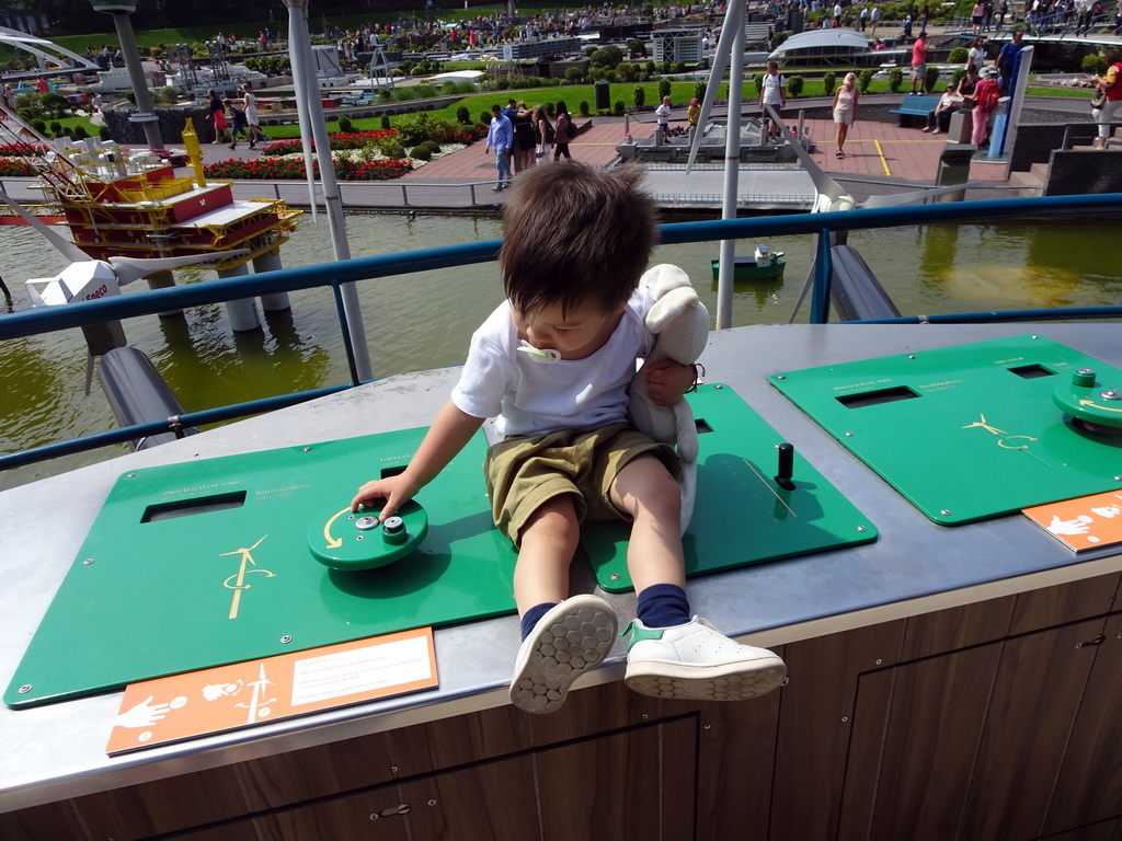 Max playing with the wind turbines at the Madurodam miniature park