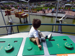 Max playing with the wind turbines at the Madurodam miniature park