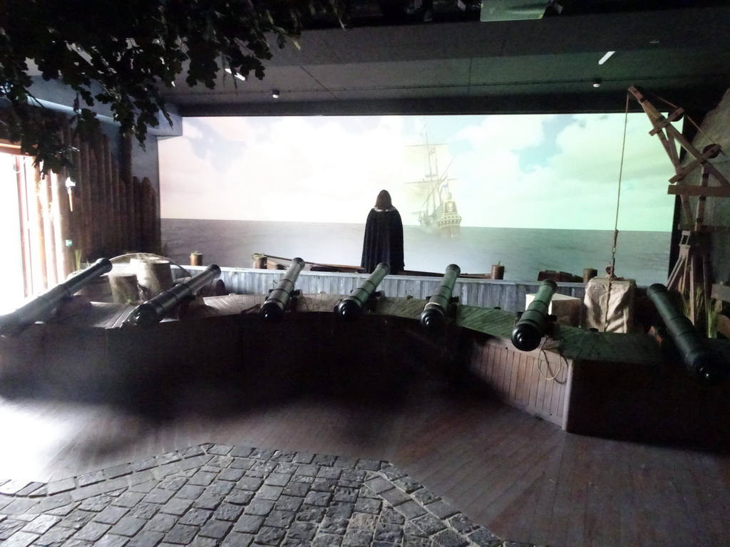 Cannons, wax statue of Peter Stuyvesant and a big screen in the `Nieuw Amsterdam` attraction at the Madurodam miniature park