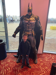 Max with a Batman statue at the Sir Winston Fun & Games arcade