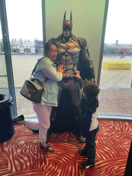Miaomiao and Max with a Batman statue at the Sir Winston Fun & Games arcade