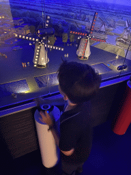 Max with scale models of windmills at the The Hague Miniland at the Legoland Discovery Centre, by night