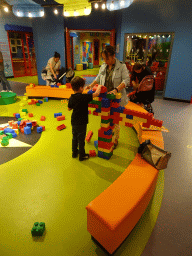 Miaomiao and Max playing with large Lego blocks at the Building Area at the Legoland Discovery Centre
