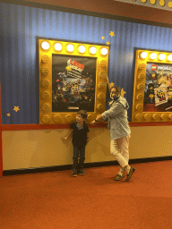 Miaomiao and Max with a movie poster at the lobby of the 4D Cinema at the Legoland Discovery Centre