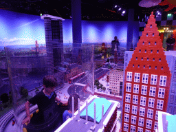 Max with scale models of the skyscrapers of The Hague and other buildings at the The Hague Miniland at the Legoland Discovery Centre