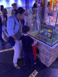 Miaomiao and Max with a scale model of a music festival at the The Hague Miniland at the Legoland Discovery Centre