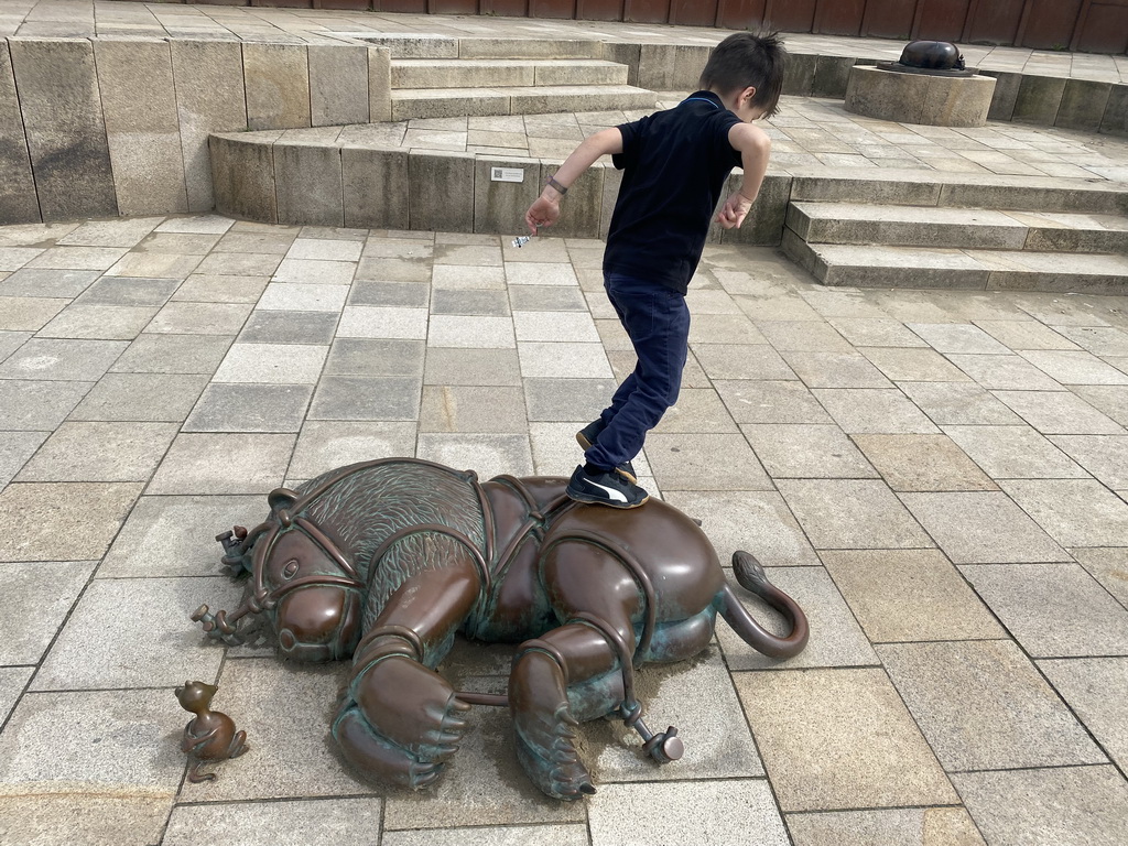 Max with a Fairytale Statue at the Strandweg street