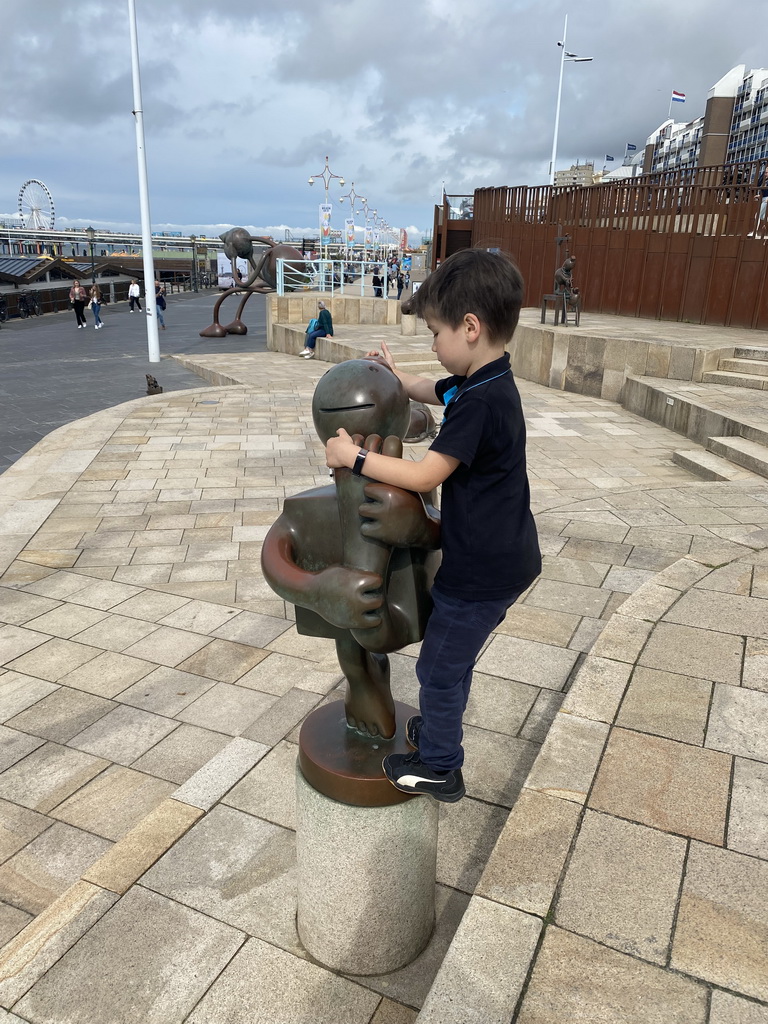 Max with a Fairytale Statue at the Strandweg street