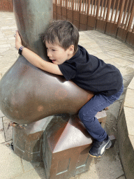 Max with a Fairytale Statue at the Strandweg street