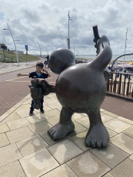 Max with a Fairytale Statue at the Strandweg street