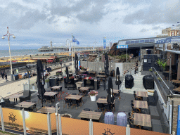 Terrace of the `t Boothuys restaurant and the front of Sea Life Scheveningen at the Strandweg street