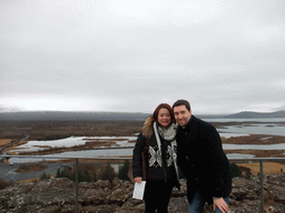 Tim and Miaomiao at the viewing point at the visitor centre of Þingvellir National Park, with a view on the north side of the Þingvallavatn Lake and the Almannagjá fault