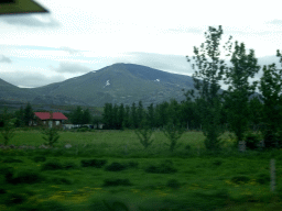 Farms and mountain, viewed from the rental car on the Þingvallavegur road near Mosfellsdalur