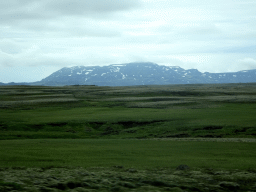 Grassland and mountains, viewed from the rental car on the Þingvallavegur road