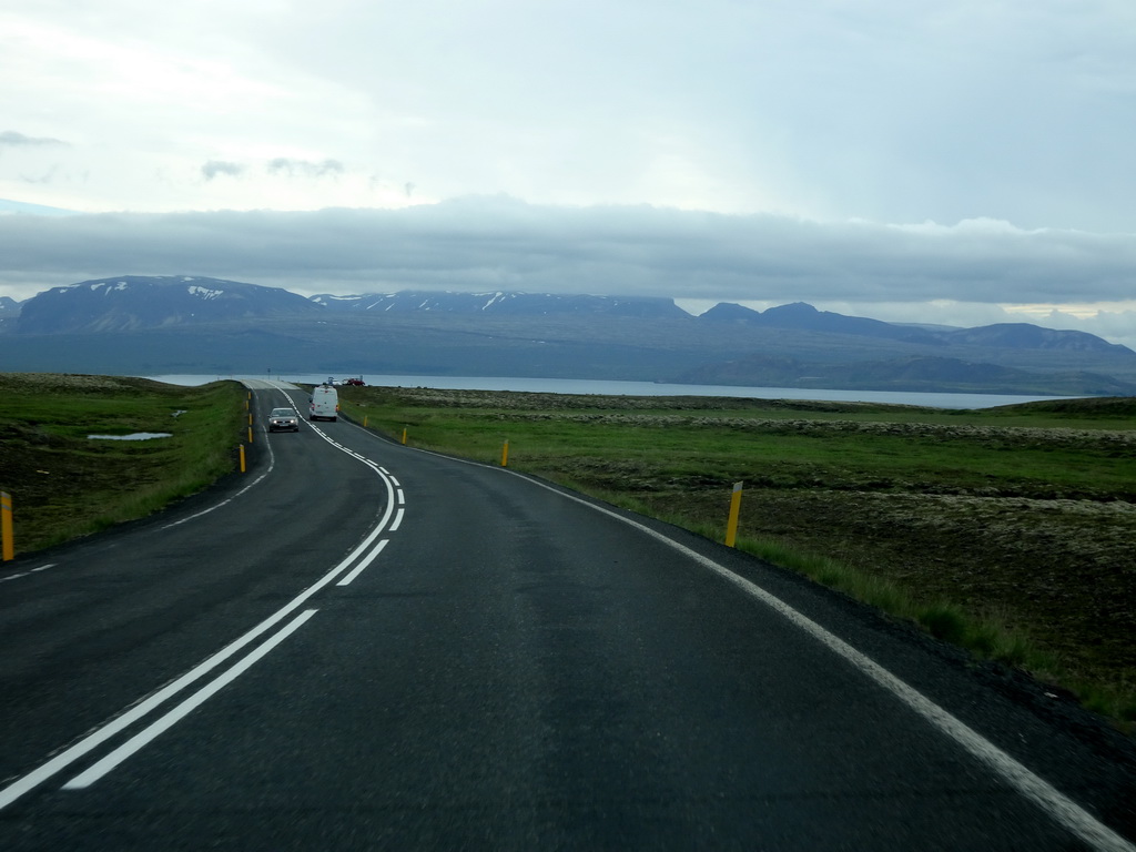 The Þingvallavegur road, the west side of the Þingvallavatn lake and mountains, viewed from the rental car