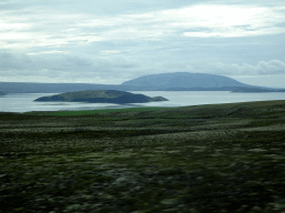 The west side of the Þingvallavatn lake with the Sandey and Nesjaey islands, viewed from the rental car on the Þingvallavegur road