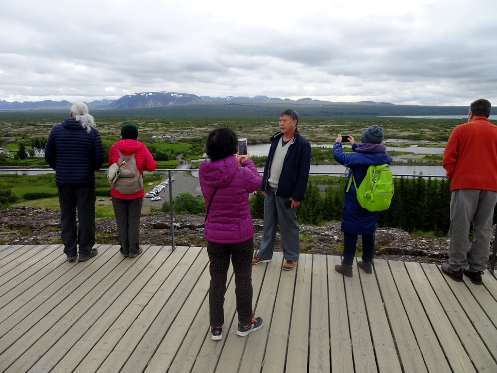 Miaomiao`s parents at the Hakið Viewing Point, with a view on the Þingvellir National Park and the north side of Þingvallavatn lake