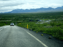 The Þingvallavegur road and the Thingvellir Tourist Information Centre at the crossing of the Þingvallavegur road and the Uxahryggjavegur road, viewed from the rental car