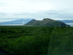 The northeast side of the Þingvallavatn lake, smoke from a power plant and mountains, viewed from the rental car on the Þingvallavegur road