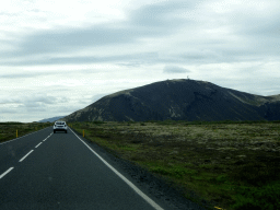 The Þingvallavegur road and a mountain, viewed from the rental car
