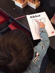 Max with a `Kikker` coloring page at the Museumcafé at the ground floor of the Natuurmuseum Brabant