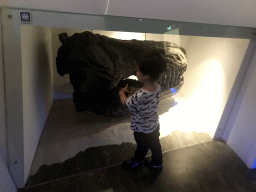 Max with a skull of a Tyrannosaurus Rex at the `Uitsterven` exhibition at the second floor of the Natuurmuseum Brabant