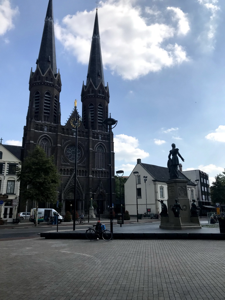 Statue of King William II and the front of the Sint-Jozefkerk church at the Heuvel square