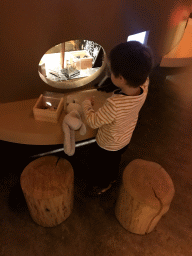 Max playing with spider toys at the `Beleef Ontdek Samen: BOS` exhibition at the second floor of the Natuurmuseum Brabant