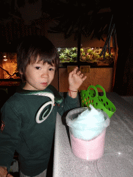 Max with a snake toy and candyfloss at the Ground Floor of the main building of the Dierenpark De Oliemeulen zoo