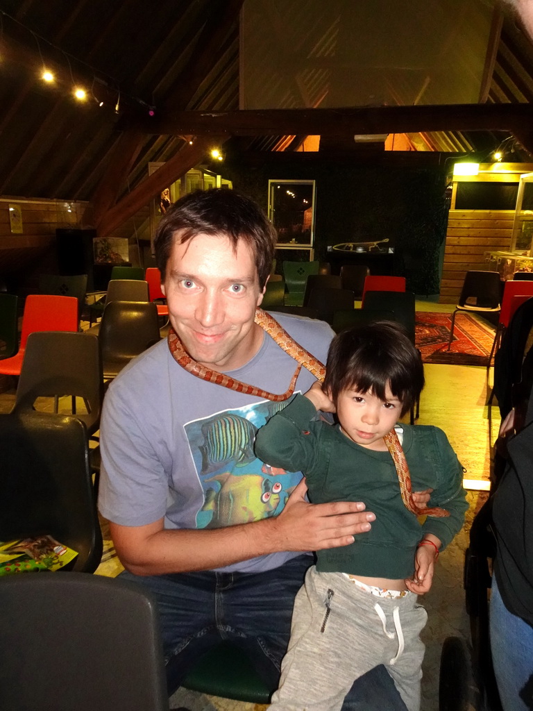 Tim and Max with a snake during the snake and spider demonstration at the Upper Floor of the main building of the Dierenpark De Oliemeulen zoo