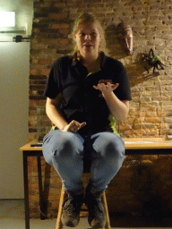 Zookeeper with a spider during the snake and spider demonstration at the Upper Floor of the main building of the Dierenpark De Oliemeulen zoo