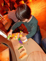 Max playing with toy food at the `Beleef Ontdek Samen: BOS` exhibition at the second floor of the Natuurmuseum Brabant