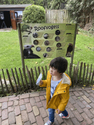 Max with a sign of the Birds of Prey Show at the Dierenpark De Oliemeulen zoo