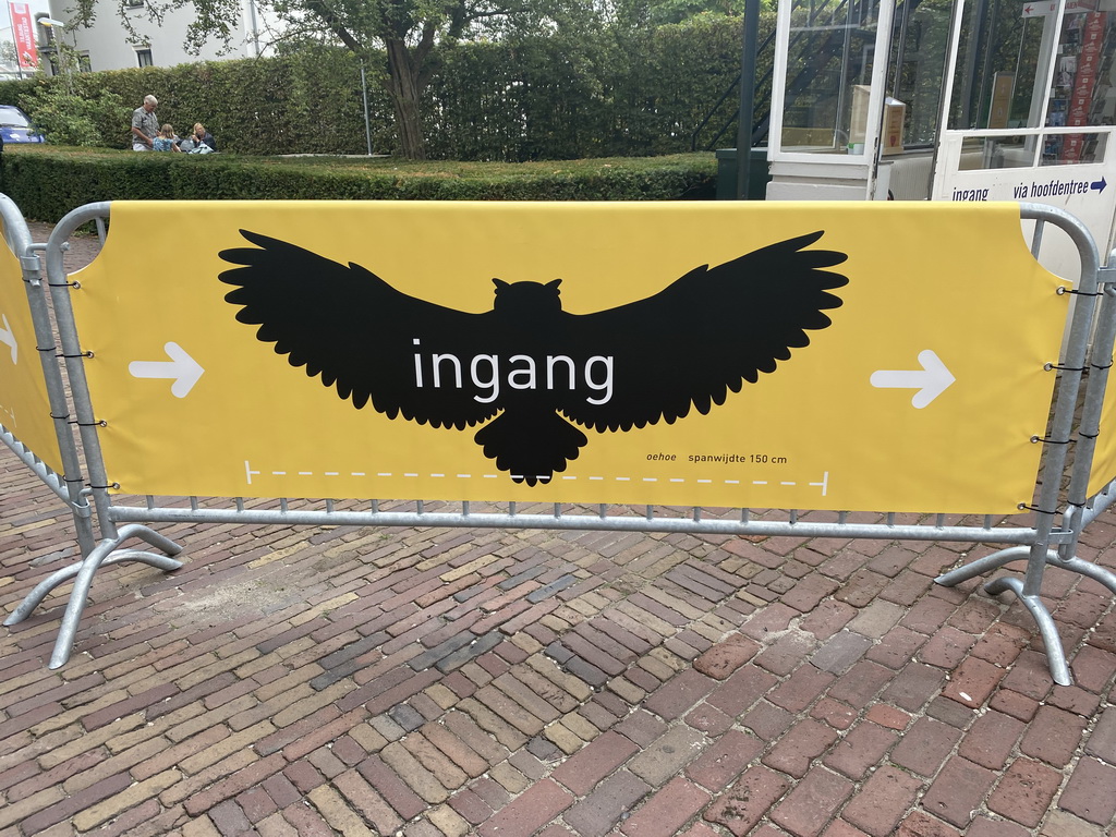 Sign with the wingspan of a Eurasian Eagle-owl for keeping distance because of COVID-19 at the entrance to the Natuurmuseum Brabant at the Spoorlaan street