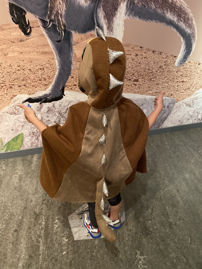 Max with dinosaur clothes at the `Vreemde vogels, die dino`s` exhibition at the second floor of the Natuurmuseum Brabant