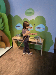 Max at the fishing game at the `Kikker is hier!` exhibition at the second floor of the Natuurmuseum Brabant