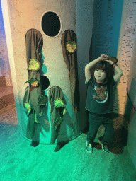 Max at a tree at the `Beleef Ontdek Samen: BOS` exhibition at the second floor of the Natuurmuseum Brabant