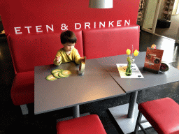 Max playing with coasters at the Museumcafé at the ground floor of the Natuurmuseum Brabant