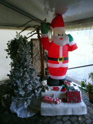 Statue of Santa Claus, a christmas tree and christmas presents at the Dierenpark De Oliemeulen zoo