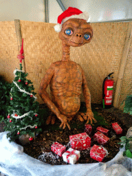Statue of E.T., a christmas tree and christmas presents at the Dierenpark De Oliemeulen zoo