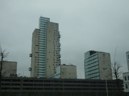 The StadsHeer building and the back side of the Tilburg Railway Station, viewed from the car on the Burgemeester Brokxlaan street