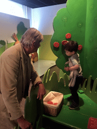 Max and his grandfather at the apple tree at the `Kikker is hier!` exhibition at the second floor of the Natuurmuseum Brabant