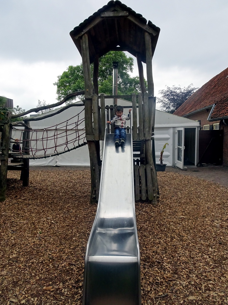 Max on the slide at the playground at the Dierenpark De Oliemeulen zoo