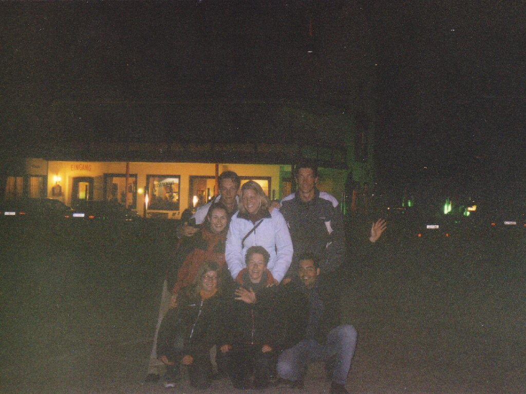 Tim and his friends in front of the Alpenhof Hotel at the Innsbrucker Straße street at Brixlegg, by night