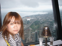 Miaomiao and a view on Fort York and the Ricoh Coliseum, from the 360 Revolving Restaurant in the CN Tower
