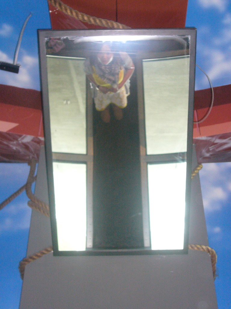 Miaomiao in a mirror at the Glass Floor in the CN Tower