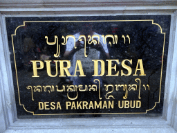 Sign in front of the entrance to the Pura Desa Ubud temple at the Jalan Raya Ubud street